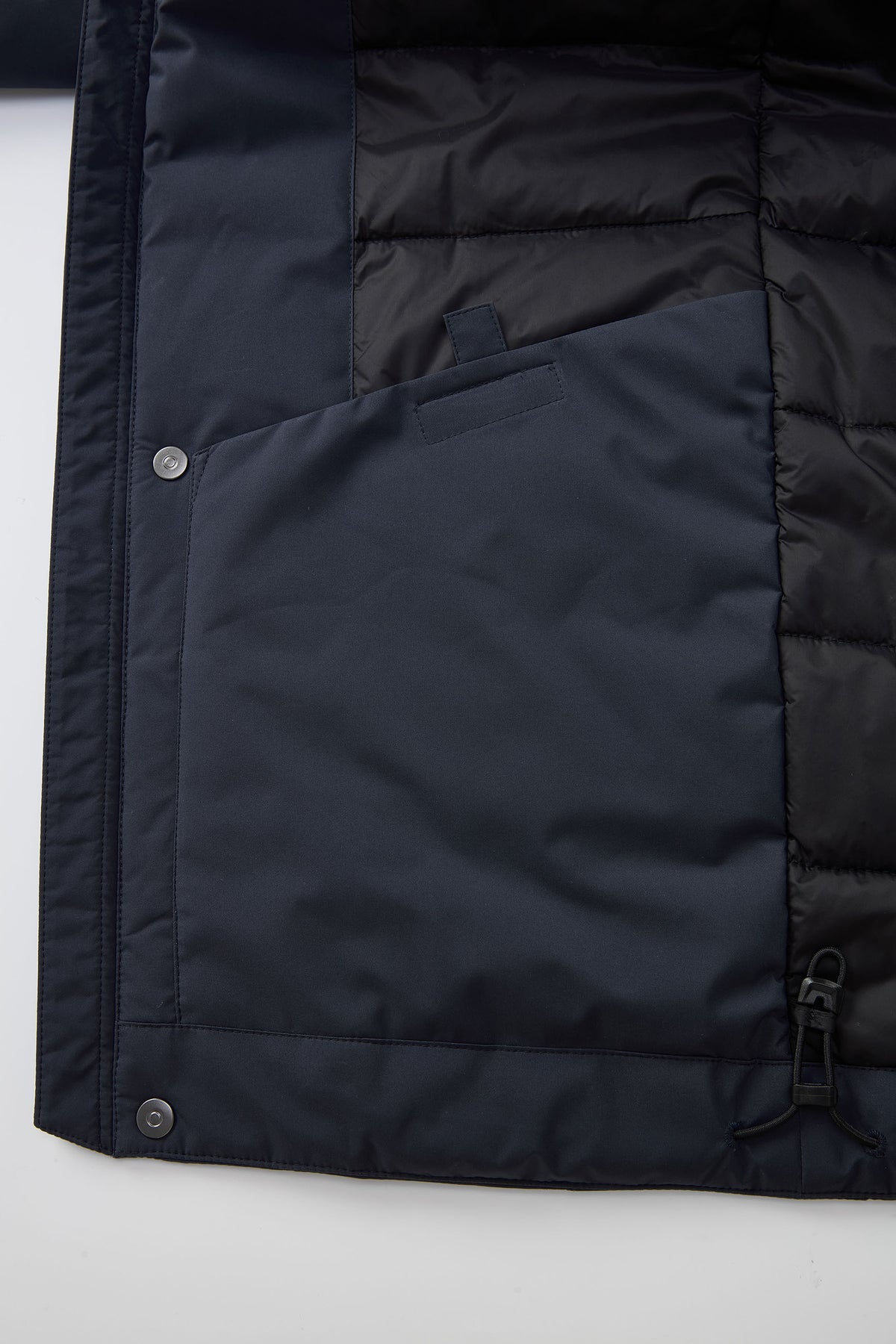 Adjustable hood and hem for a more secure fit
