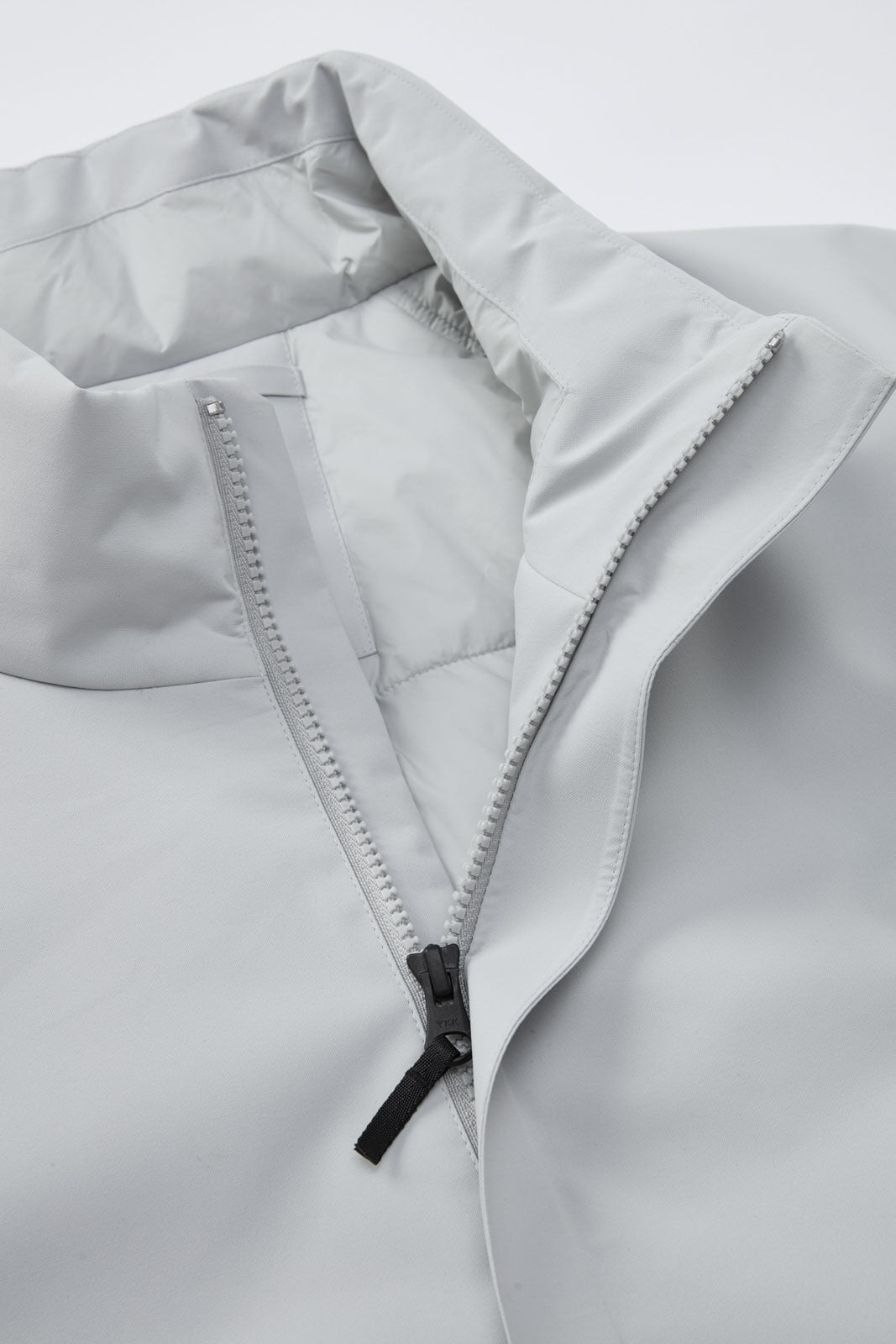 Stand collar with soft ribbed detailing for enhanced comfort and a refined feel