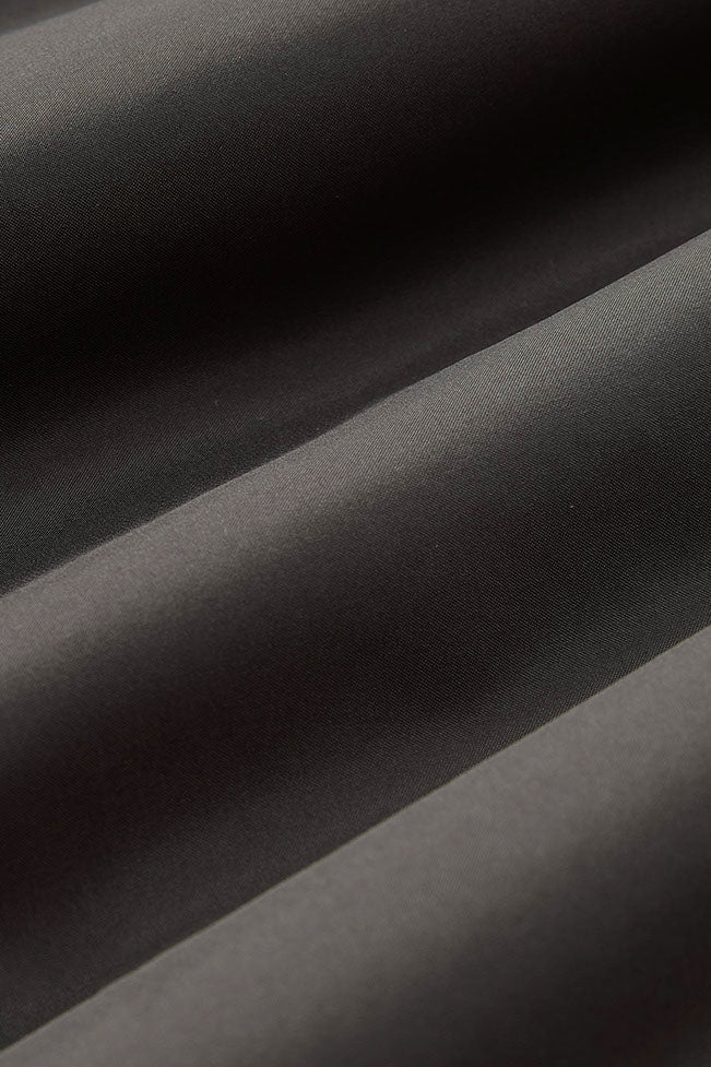 Four-layer construction to help prevent down leakage